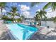 Backyard pool with patio and lounge chairs, offering outdoor space for relaxing and enjoying the waterfront at 533 Lillian Dr, Madeira Beach, FL 33708