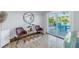 Sitting area with bright view of pool, waterfront, tropical foliage, and Adirondack chairs at 533 Lillian Dr, Madeira Beach, FL 33708