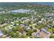 Wide aerial shot featuring a residential neighborhood surrounded by lush trees with city views at 568 La Plaza S Ave, St Petersburg, FL 33707
