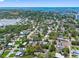 Coastal neighborhood aerial showcasing lush trees and city views with bay in the background at 568 La Plaza S Ave, St Petersburg, FL 33707