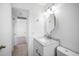 Bathroom featuring an updated vanity with a stylish mirror and tile flooring at 568 La Plaza S Ave, St Petersburg, FL 33707