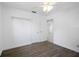 Bedroom featuring hardwood floors, a ceiling fan, and closet for ample storage at 568 La Plaza S Ave, St Petersburg, FL 33707