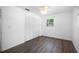 Bedroom features wood-look floors and a spacious closet at 568 La Plaza S Ave, St Petersburg, FL 33707