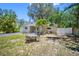 A charming single-story home featuring manicured landscaping, a paved driveway, and inviting outdoor seating at 568 La Plaza S Ave, St Petersburg, FL 33707