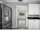 Stylish kitchen with stainless steel refrigerator and modern cabinetry at 568 La Plaza S Ave, St Petersburg, FL 33707