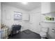 Bright laundry room with utility sink, and updated fixtures and flooring at 568 La Plaza S Ave, St Petersburg, FL 33707