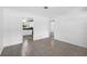 Living room with tile flooring offers a view into the kitchen area at 568 La Plaza S Ave, St Petersburg, FL 33707