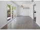 Large open space featuring tile flooring, sliding glass doors, and an open layout into the kitchen at 568 La Plaza S Ave, St Petersburg, FL 33707