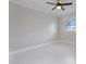 This bedroom has neutral walls, tile floors, and a ceiling fan at 5800 Dartmouth N Ave, St Petersburg, FL 33710