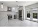 Spacious kitchen with sleek appliances, white cabinets, and a view to the outdoors at 5800 Dartmouth N Ave, St Petersburg, FL 33710