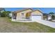 Inviting home with a two-car garage and a charming front porch with white picket fence at 5906 Greenbriar Ct, Zephyrhills, FL 33542