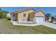 Inviting home with a two-car garage and a charming front porch with white picket fence at 5906 Greenbriar Ct, Zephyrhills, FL 33542