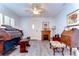 Cozy living room featuring laminate floors, a fireplace and various antique furnishings at 5906 Greenbriar Ct, Zephyrhills, FL 33542