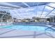 Large, well-maintained screened-in pool perfect for swimming and enjoying sunny days at 5906 Greenbriar Ct, Zephyrhills, FL 33542