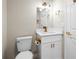 Bright bathroom with white vanity, quartz countertop, modern lighting, and gold fixtures at 5980 80Th St N # 106, St Petersburg, FL 33709