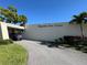 Welcoming entrance to Magnolia Sun Center with a well-maintained driveway, lush landscaping, and clear signage at 5980 80Th St N # 106, St Petersburg, FL 33709