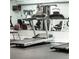 Home gym with treadmills, weights and exercise equipment at 5980 80Th St N # 106, St Petersburg, FL 33709