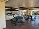 Outdoor kitchen and picnic area featuring a built-in grill, sink, and comfortable seating for community gatherings at 5980 80Th St N # 106, St Petersburg, FL 33709