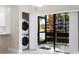 Enclosed patio with view of the water, and a stacked washer/dryer at 5980 80Th St N # 106, St Petersburg, FL 33709