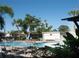 Outdoor swimming pool with ample seating and lush landscaping at 5980 80Th St N # 106, St Petersburg, FL 33709