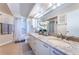Luxurious bathroom featuring granite countertops, dual sinks, and updated fixtures at 6191 Bahia Del Mar Blvd # 103, St Petersburg, FL 33715