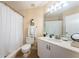 Bathroom featuring a shower-tub combo, single vanity, and bright lighting for a clean feel at 6191 Bahia Del Mar Blvd # 103, St Petersburg, FL 33715