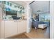 Serene bedroom featuring a wet bar and views of the tropical outdoors at 6191 Bahia Del Mar Blvd # 103, St Petersburg, FL 33715