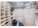 Functional walk-in closet with extensive built-in shelving for optimal storage at 6191 Bahia Del Mar Blvd # 103, St Petersburg, FL 33715