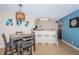 Cozy dining area with barstool seating and stainless steel appliances in the background at 6191 Bahia Del Mar Blvd # 103, St Petersburg, FL 33715