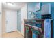Hallway with a decorative cabinet and view of the entrance door at 6191 Bahia Del Mar Blvd # 103, St Petersburg, FL 33715