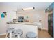 Bright kitchen features granite counters, stainless appliances, and a breakfast bar with seating at 6191 Bahia Del Mar Blvd # 103, St Petersburg, FL 33715