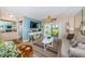 Bright living room with a flat-screen TV, sliding glass doors, and comfortable seating at 6191 Bahia Del Mar Blvd # 103, St Petersburg, FL 33715