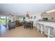 Open concept living space featuring combined living, dining, and kitchen areas with ample seating at 6191 Bahia Del Mar Blvd # 103, St Petersburg, FL 33715
