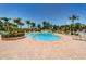 Relaxing community swimming pool area with palm trees and plenty of lounge seating at 6191 Bahia Del Mar Blvd # 103, St Petersburg, FL 33715