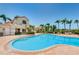 Community pool area with a clean swimming pool, surrounded by tropical landscaping and seating at 6191 Bahia Del Mar Blvd # 103, St Petersburg, FL 33715