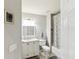 Bright bathroom features a white vanity, framed mirror, and shower-tub combination at 6910 Rock Springs Way, Tampa, FL 33625