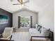 Comfortable bedroom featuring a daybed, desk, and bright windows with natural light at 6910 Rock Springs Way, Tampa, FL 33625
