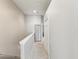 Clean hallway with neutral paint and carpet leads to additional rooms at 6910 Rock Springs Way, Tampa, FL 33625
