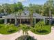 Community pool house with outdoor seating areas and meticulously maintained landscaping at 6910 Rock Springs Way, Tampa, FL 33625