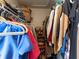 Organized walk-in closet with shelving for shoes, hanging rods, and overhead storage at 6910 Rock Springs Way, Tampa, FL 33625