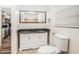 Bathroom featuring double sinks, granite counters, and a tiled shower stall at 7309 N Huntley Ave, Tampa, FL 33604