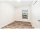 Bright bedroom with a window offering natural light and neutral decor at 7309 N Huntley Ave, Tampa, FL 33604