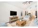 Inviting living room with vaulted ceilings, wood floors, and rustic furniture and decor at 7309 N Huntley Ave, Tampa, FL 33604
