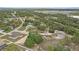 Wide aerial shot of a home, showing surrounding trees and neighborhood landscape at 7372 Madrid Rd, Weeki Wachee, FL 34613
