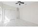 Spacious bedroom with marble floors and closet, offering a comfortable and modern living space at 7372 Madrid Rd, Weeki Wachee, FL 34613