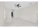 Bright bedroom featuring marble floors, contemporary ceiling fan and light walls at 7372 Madrid Rd, Weeki Wachee, FL 34613