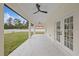 The covered patio with fans is perfect for outdoor relaxation at 7372 Madrid Rd, Weeki Wachee, FL 34613