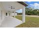 Enjoy the expansive covered patio overlooking the backyard at 7372 Madrid Rd, Weeki Wachee, FL 34613