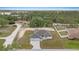 Beautiful exterior view of a one story house with a neatly cut yard in a neighborhood filled with trees at 7372 Madrid Rd, Weeki Wachee, FL 34613