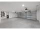 Spacious three-car garage providing ample parking and storage space for vehicles and equipment at 7372 Madrid Rd, Weeki Wachee, FL 34613